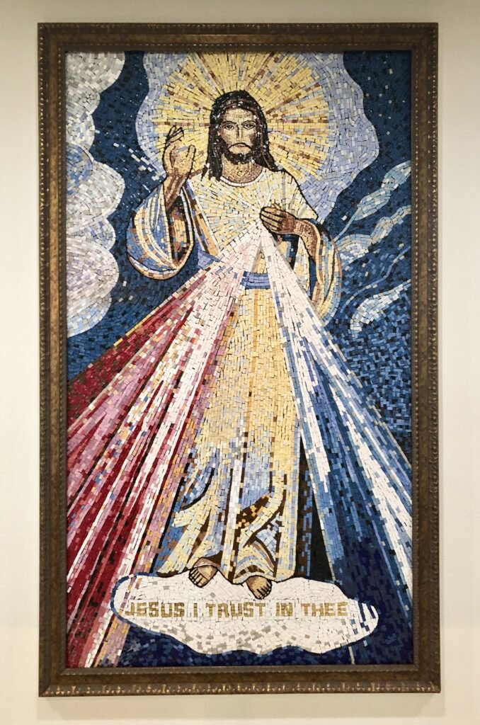 Framed Divine Mercy mosaic with Jesus and red and pale rays at Saint Columban in Garden Grove.