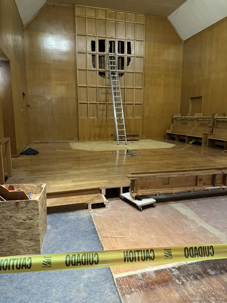 Exposed framing in the former paneled sanctuary wall.