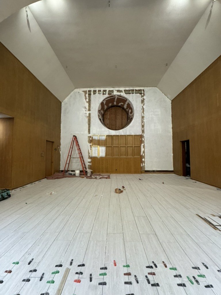 Cleared sanctuary with floor protection and work around the round window opening.