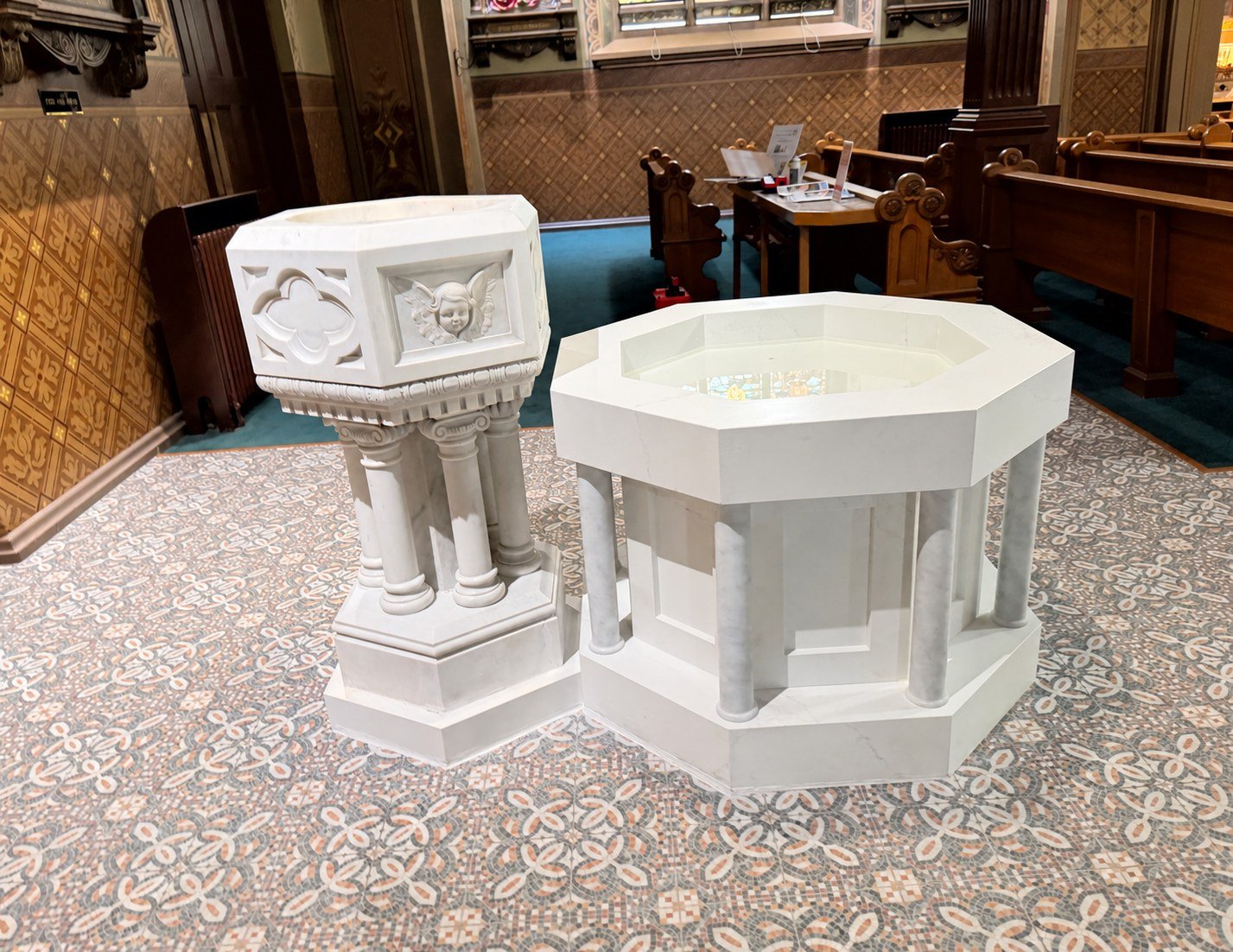 A restored historic font and new marble basin at St. Francis of Assisi in Sacramento